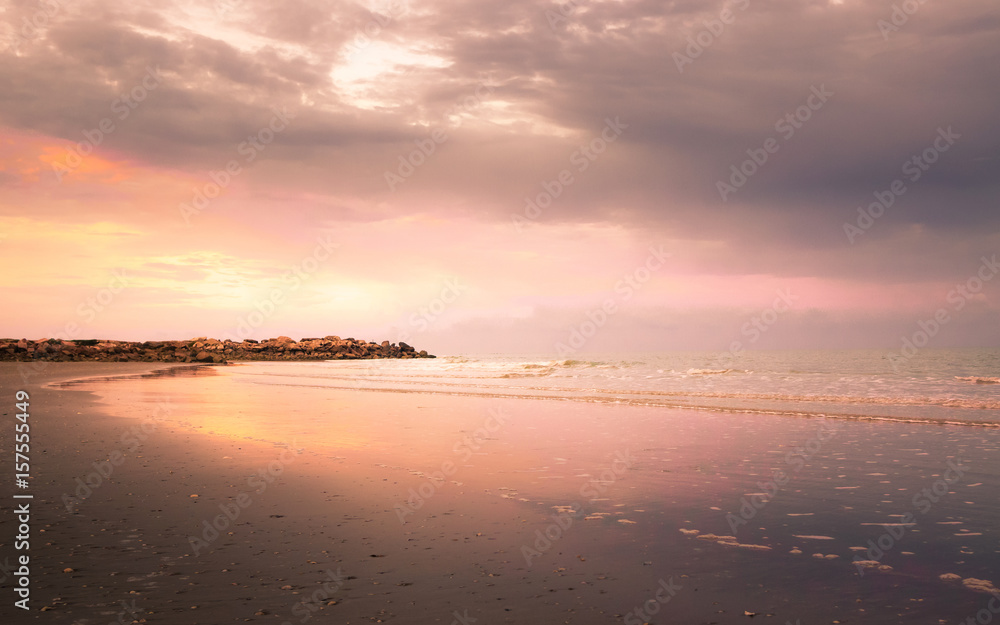 Dramatic coastline sunset with twilight time in yellow and magenta tone : Seascape
