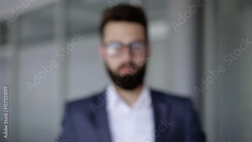 Businessman making touch with his hand like he's using a hologram