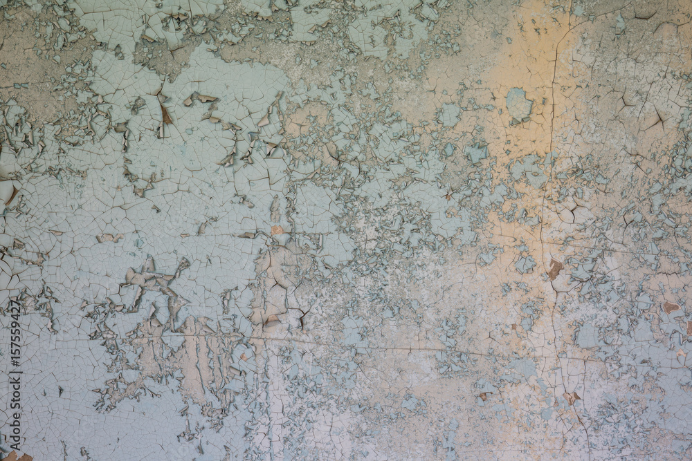 withered blue peeling paint on cement wall texture