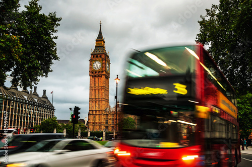 Fototapeta Naklejka Na Ścianę i Meble -  Red bus in front of Parliament building in London, UK.