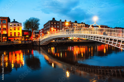 Canvas Print Dublin, Ireland. Night view of famous illuminated Ha Penny Bridge