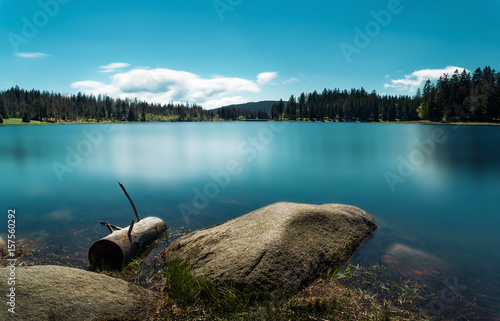 Oderteich im Harz mit blauem Himmel und türkisem Wasser im Sommer photo