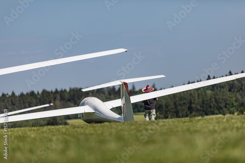 Glider on the grassy airfield. photo