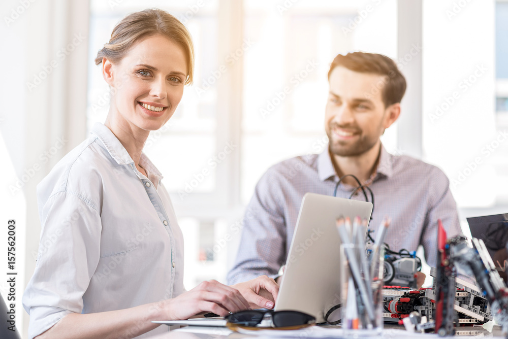 Obraz premium Charming engineer female working in office