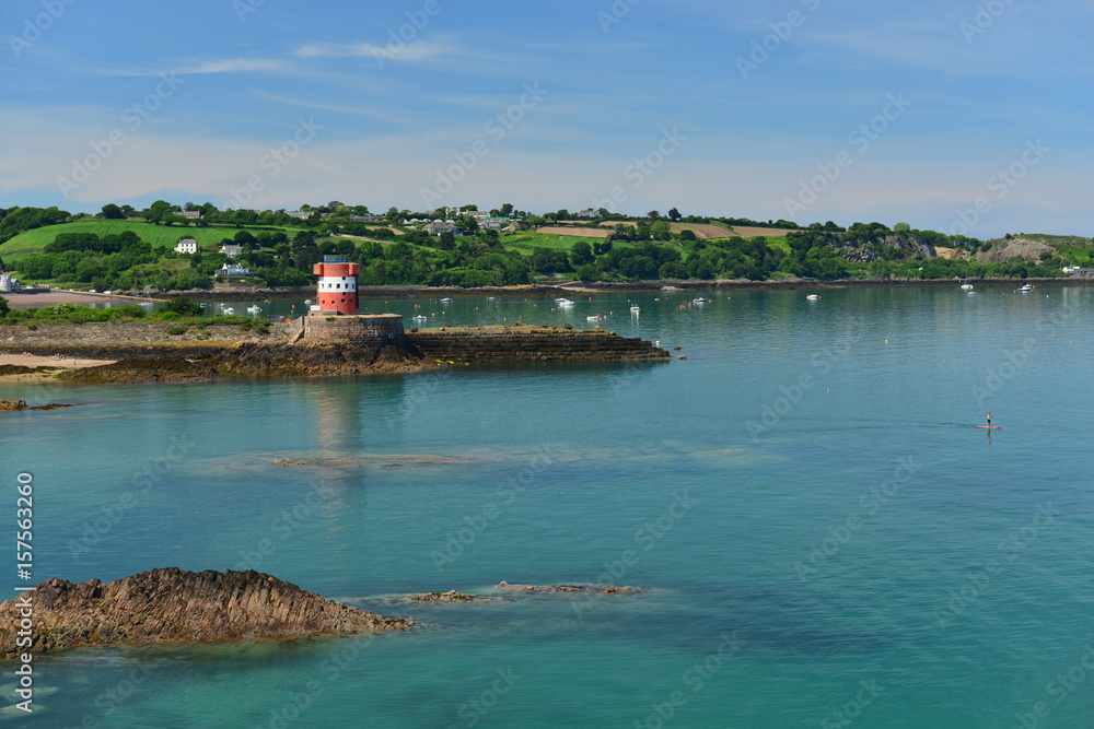 Archirondel tower, Jersey, U.K.  !9th century uninhabited military tower with the most flattest calm Summer high tide in the Bay of St Catherine.