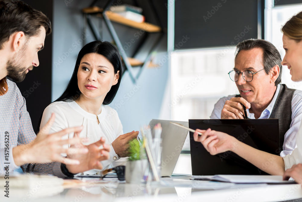 Fototapeta premium Professional successful team sitting around table