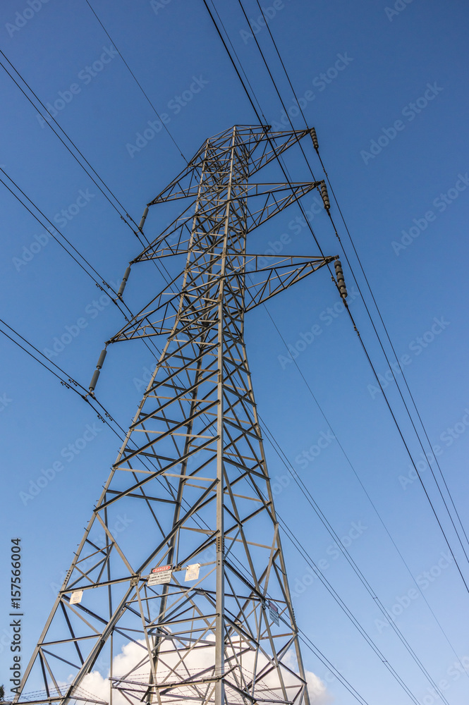 Electricity supply towers and structures transmit power along high voltage wires and cables