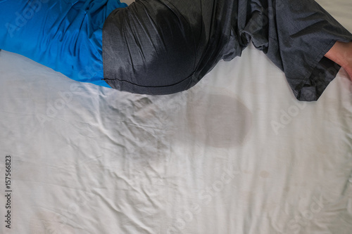 Adults pee on a bed mattress,Bedwetting sleep enuresis in Adults ,selected focus at wet on the bed
