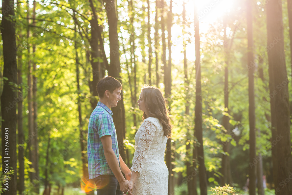 Portrait of a young romantic couple embracing each other on nature Portrait of a young romantic couple embracing each other on nature