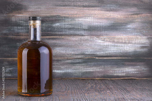 Bottle of whiskey on a wooden