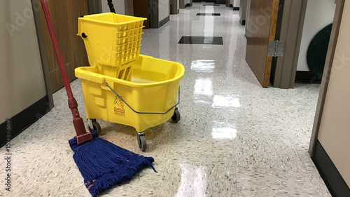 Janitors mopping bucket and mop