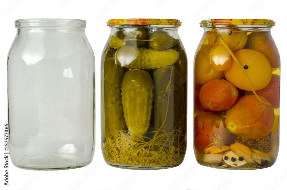 Pickled cucumbers and tomatoes in jars Pickled cucumbers and tomatoes in jars
