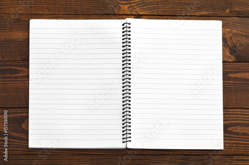 Open notebook with blank lined pages