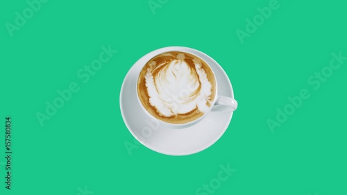 Cappuccino. Cut ready to design banners and advertising. A cup of latte, cappuccino or espresso coffee with milk put on green screen. Latte art milk on top with flowers