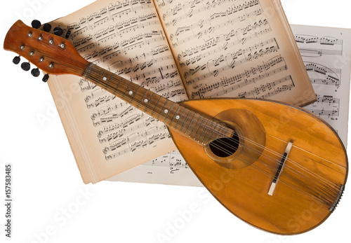 Tableau sur toile Vintage mandolin on a background of open sheet music book.