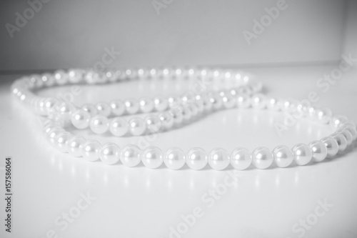 Beads from pearls on a white table