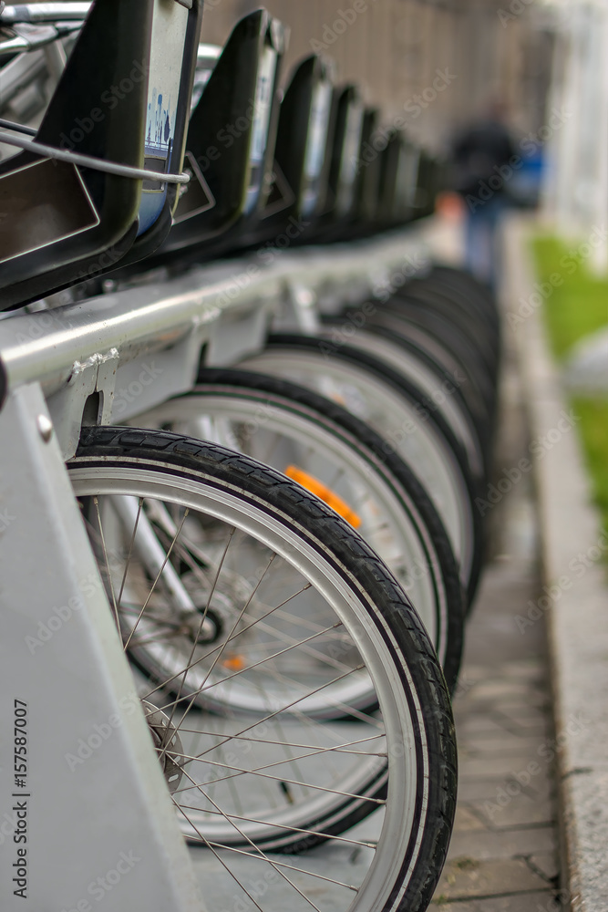 Fototapeta premium Many bicycles lined up in a parking lot