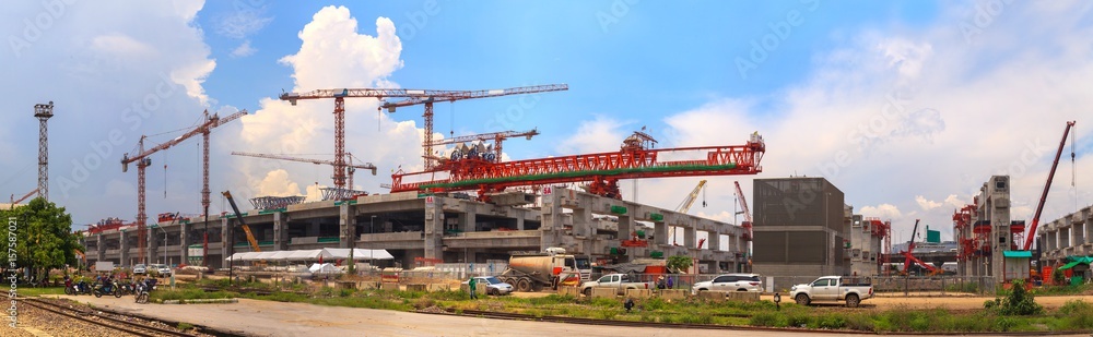Panorama of Construction site with crane under blue sky Panorama of Construction site with crane under blue sky