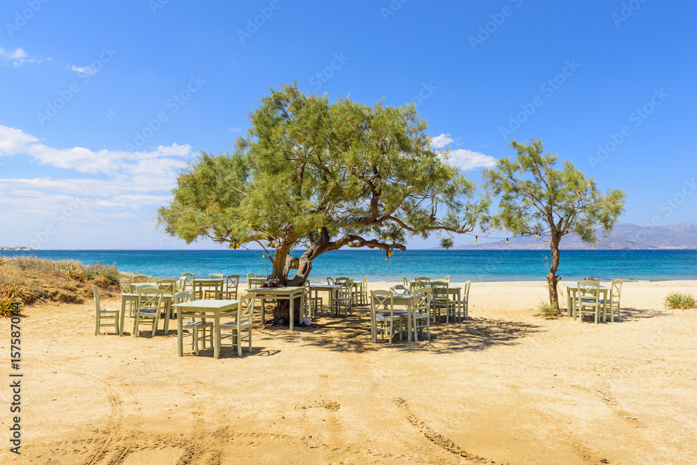 Romantic greek tavern on the Plaka beach. Naxos island, Greece.