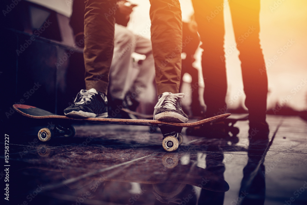 Fotografie, Obraz Skaters friends team outdoor in urban city with  skateboards in their hands | Posters.cz