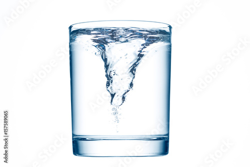 A glass of clean water with whirlpool.