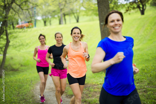 group of people enjoying in the fitness having fun running outside