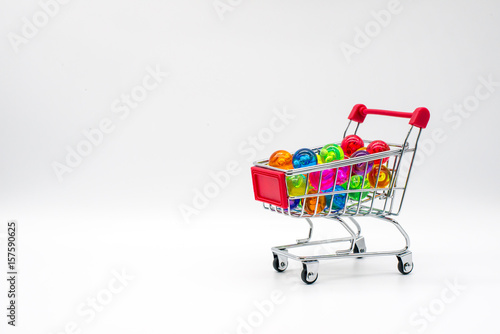 shopping cart containing colorful balls