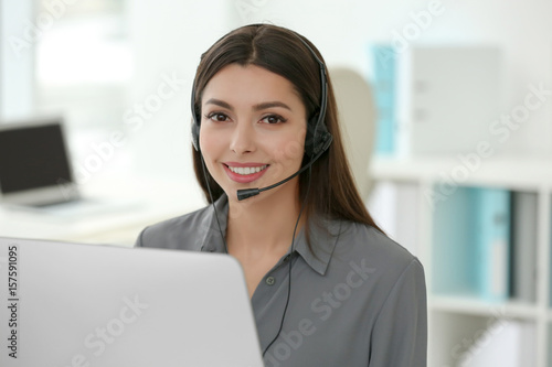 Pretty technical support dispatcher working in office
