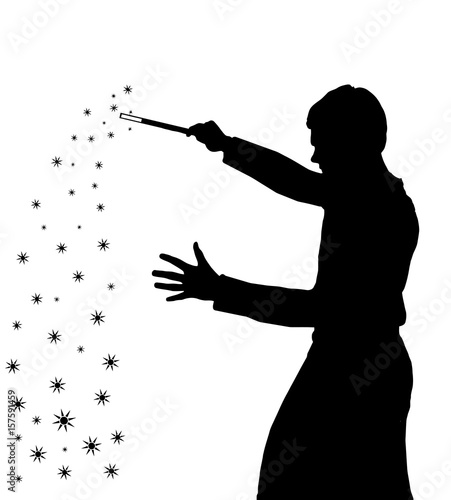 Silhouette of teenage boy wizard creating magic