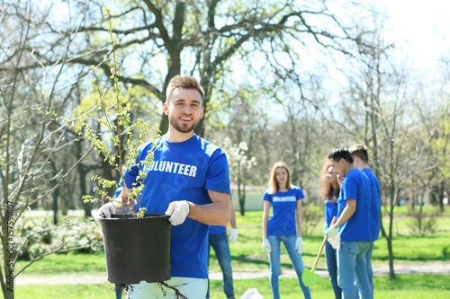 Handsome young volunteer wi...