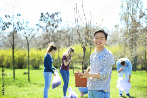 Young Asian volunteer with ...