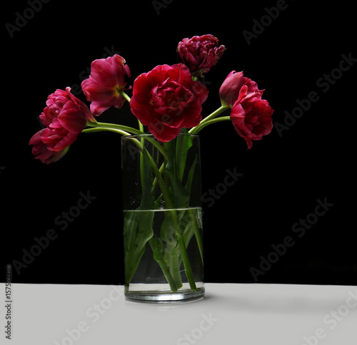 Beautiful bouquet of tulips on black background
