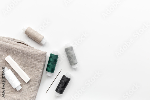 tailor workspace with sewing and handmade tools white desk background top view mock up