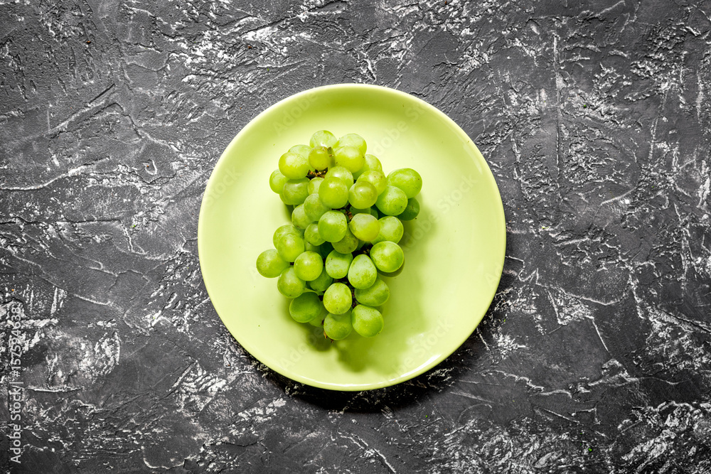 organic food for homemade salad with green grape on dark desk background top view organic food for homemade salad with green grape on dark desk background top view