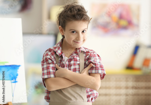 Cute little artist in studio