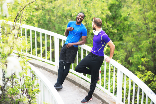 Blond bearded guy laughing with his african american friend