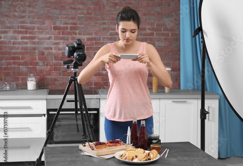 Young woman photographing f...