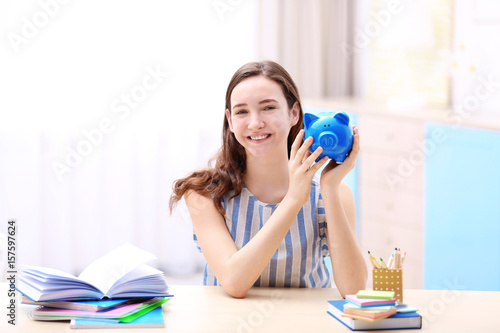 Smiling young girl sitting ...