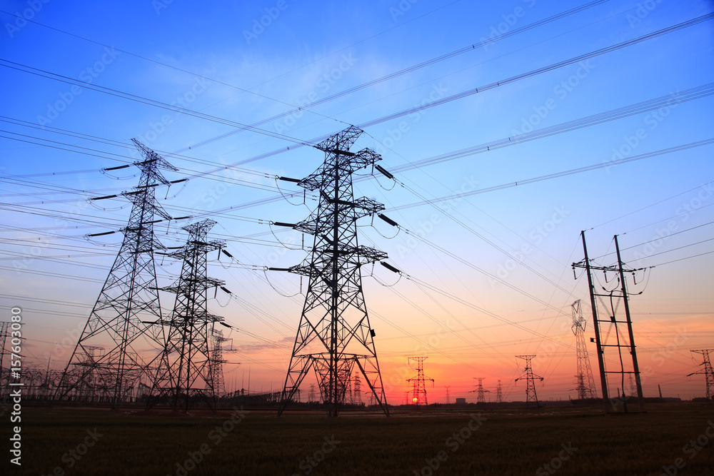 The silhouette of high voltage towers