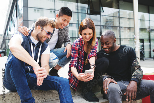 Interracial couples resting after shopping