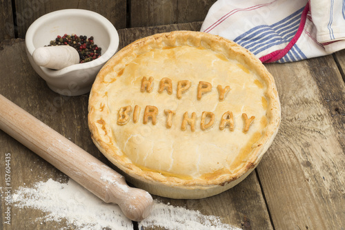 Whole Meat Pie with the Words "Happy Birthday" on Top