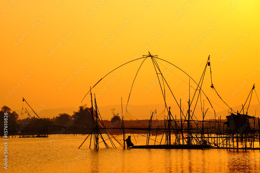 Traditional fishing tools and fishing boat in swamp