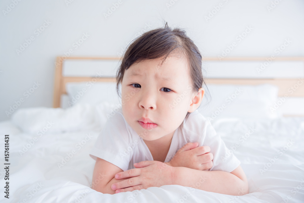 Little asian girl feel boring on bed Little asian girl feel boring on bed