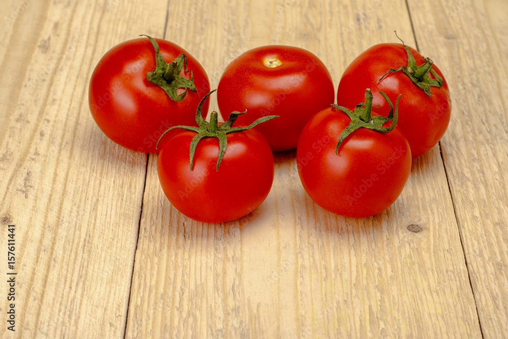 Tomatoes on a white wooden background Tomatoes on a white wooden background
