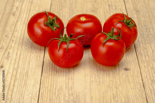 Tomatoes on a white wooden background