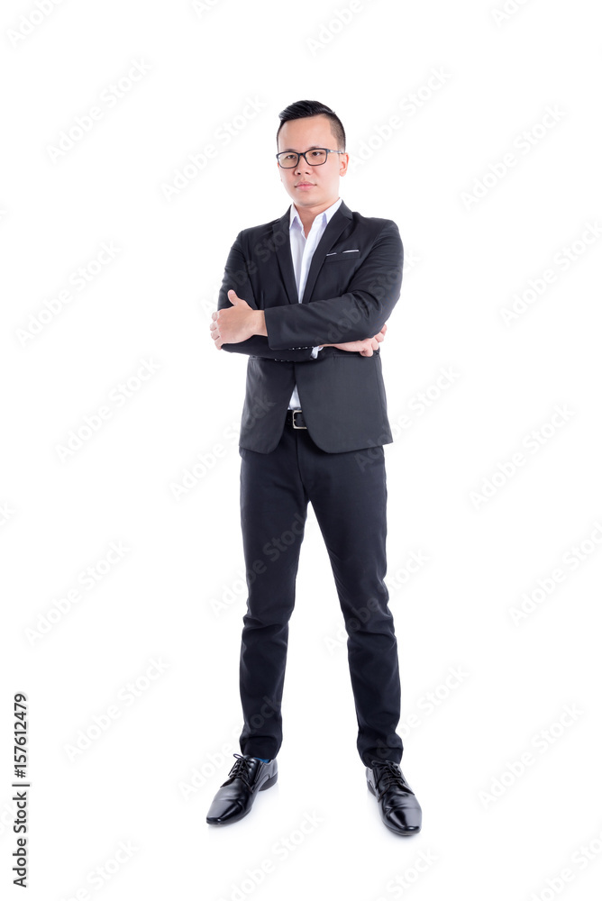 Young asian businessman standing over white background