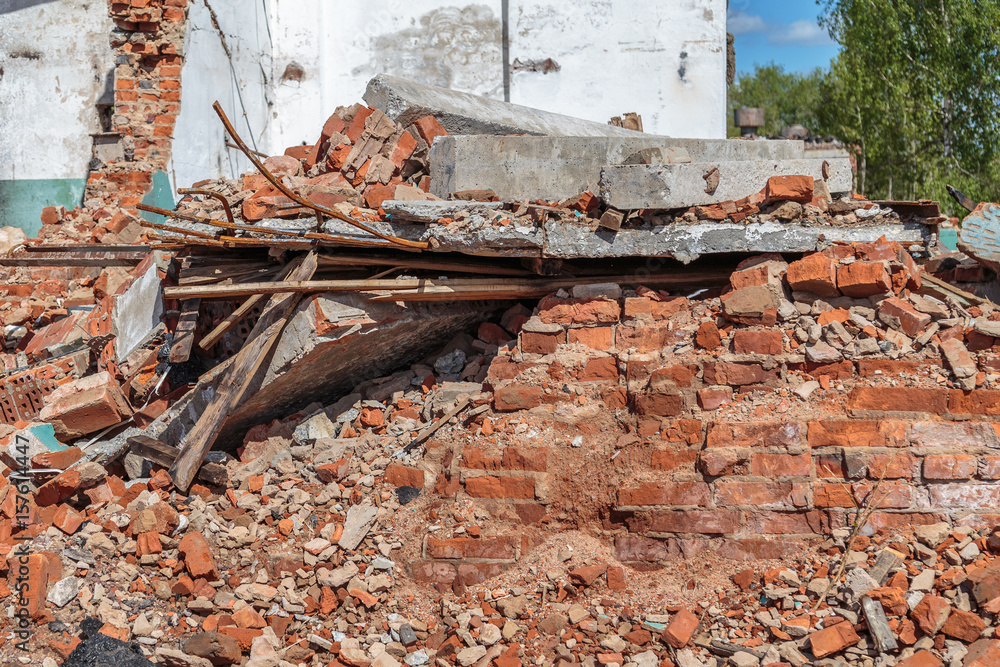 Debris of brick and plaster in place of a dilapidated house