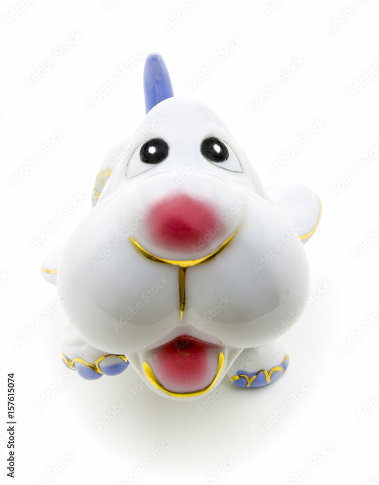 Ceramic figurine of a dog close-up on a white background. Ceramic figurine of a dog close-up on a white background.