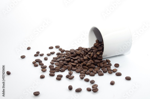 coffee beans and white coffee cup on white background