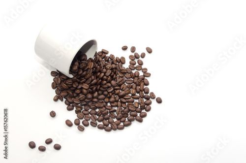 coffee beans and white coffee cup on white background